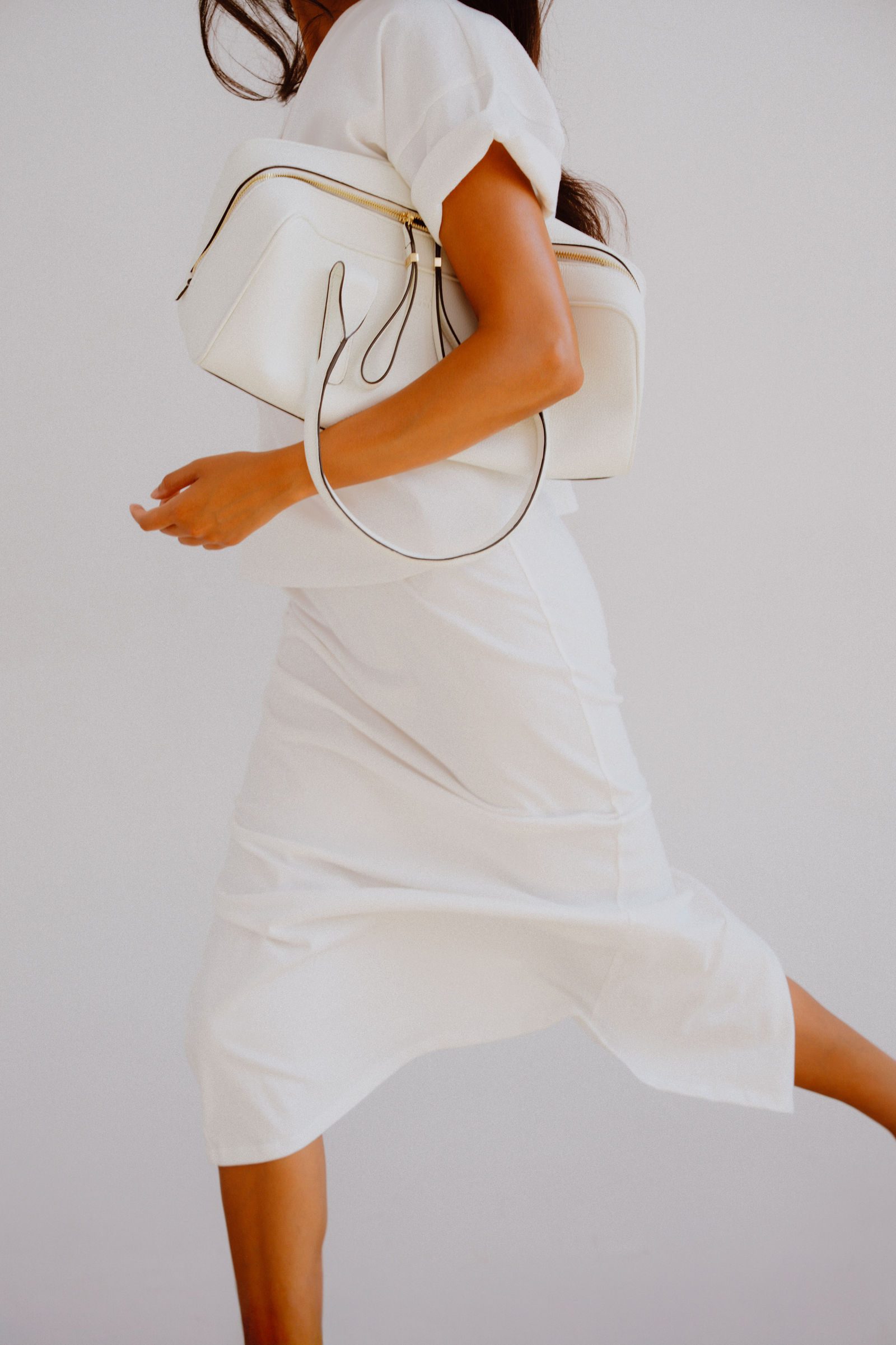 Apparel editorial, model in motion, outdoor location