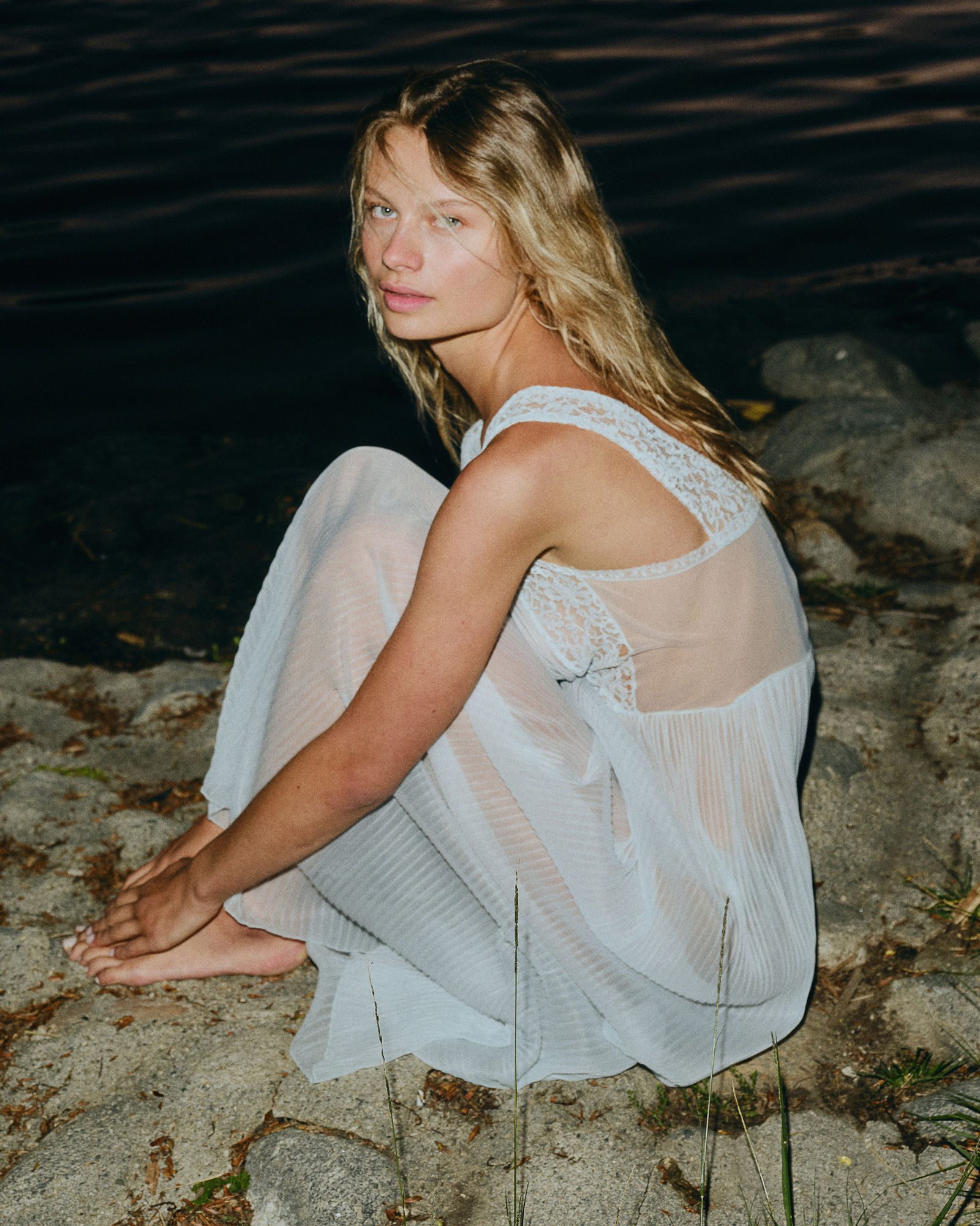 Editorial portrait, muted color palette, studio setting
